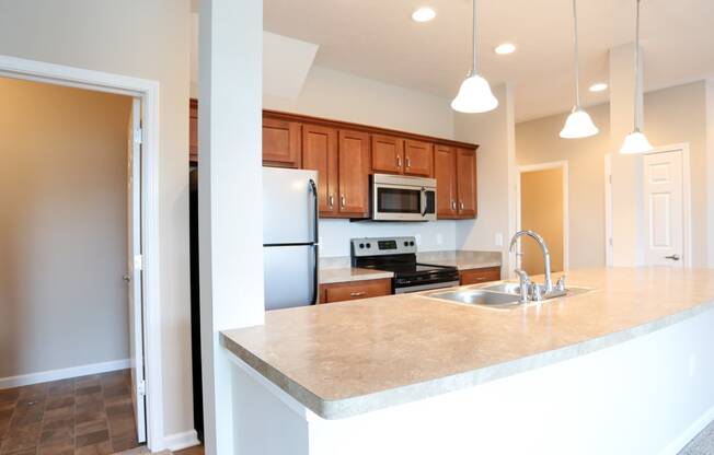 a kitchen with a large counter top and a sink