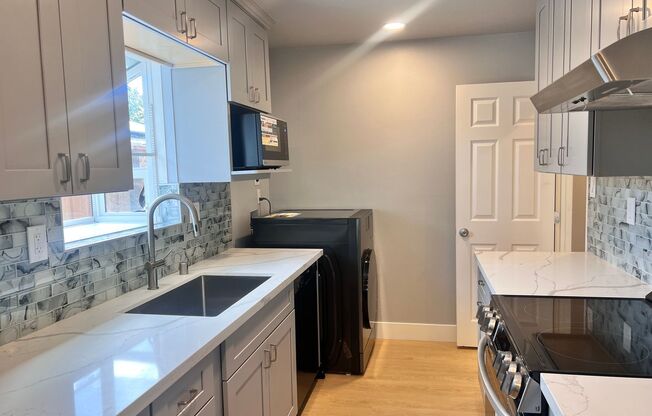 Completely Remodeled 4 Bedroom Home with Central AC and Fans in Every Room!