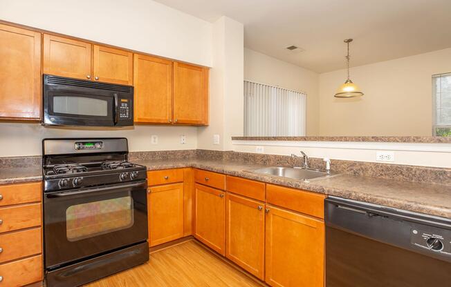 a kitchen with a stove and a microwave