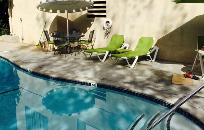 View of swimming pool with pool furniture