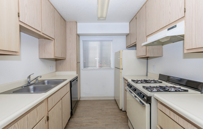 a kitchen with a stove and a sink