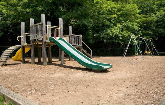 Parklike playground with slides and swings at The Columns at Lake Ridge, 3900 Lake Ridge Lane, Dunwoody, GA 30338