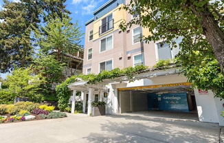 a large apartment building with a parking lot in front of it at Sir Gallahad Apartment Homes,  Bellevue, 98004