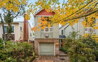 $500 move-in special! Unique 2-bdrm/2.5-bath duplex w/ A/C—Private patio, storage, garage w/ washer/dryer