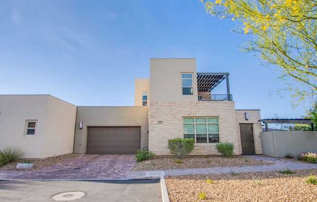 Absolutely gorgeous 2 bedroom 3.5 bathroom townhome with den in prestigious 55+ Trilogy community in Summerlin!