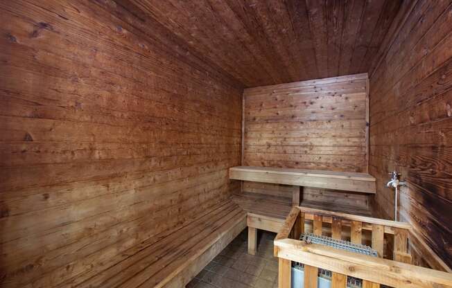 Hinton Height_Cottage Grove_MN_a sauna with wooden walls and wooden benches