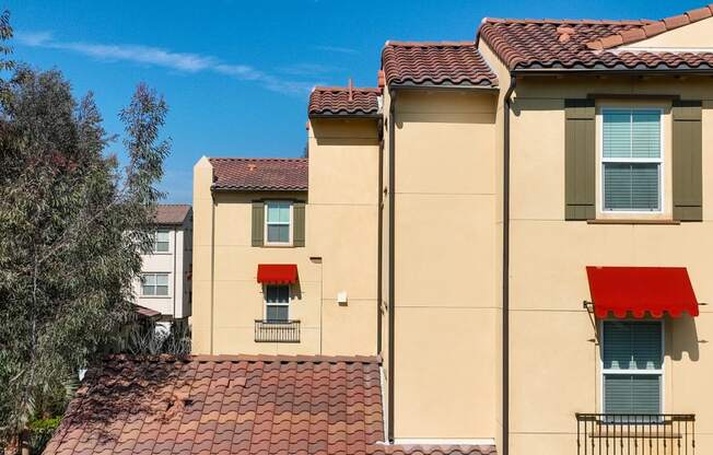 a building with a red awning on the side of it