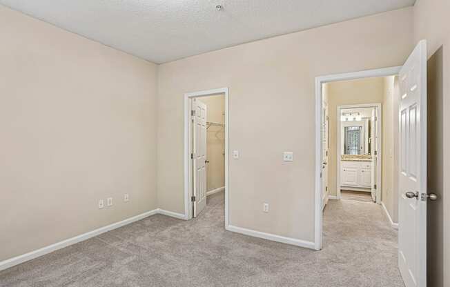 A room with a carpeted floor and white walls.