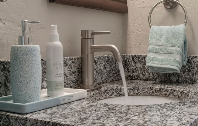 Granite countertop and modern fixture in bathroom  at Terraces at Clearwater Beach, Clearwater, Florida