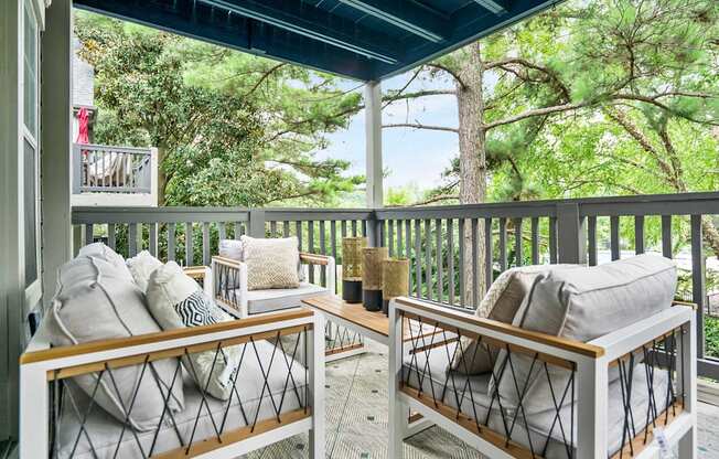 Outdoor balcony with seating and coffee table