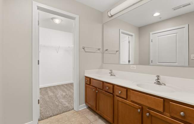 a bathroom with a sink and a mirror and a shower