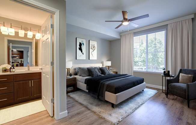 Walnut Creek Apartments for Rent-Spacious Bedroom With Gray Walls, Modern Wood Flooring, Large Window, and Ceiling Fan