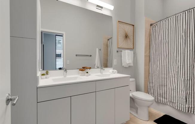 modern bathroom with tile and double sink vanity