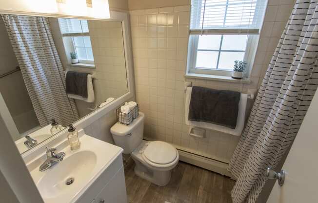 This is a photo of the bathroom in the 740 square foot 1 bedroom model apartment at Compton Lake Apartments in Mt. Healthy, OH.