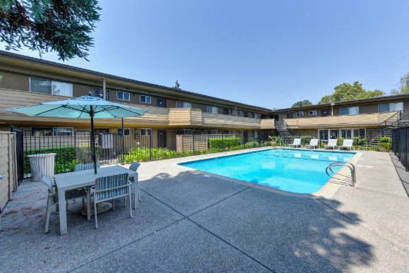 Swimming Pool and Lounge Area, Table and Sun Umbrella