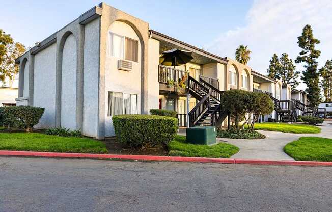A building with a red curb in front of it.