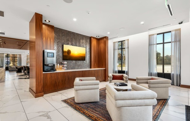 a living room filled with furniture and a flat screen tv at The Colony, Charlotte, 28211