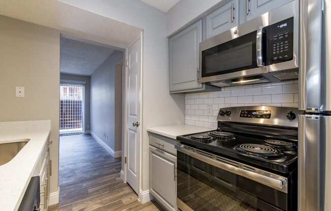 an empty kitchen Of Vine apartment in Arlington, TX