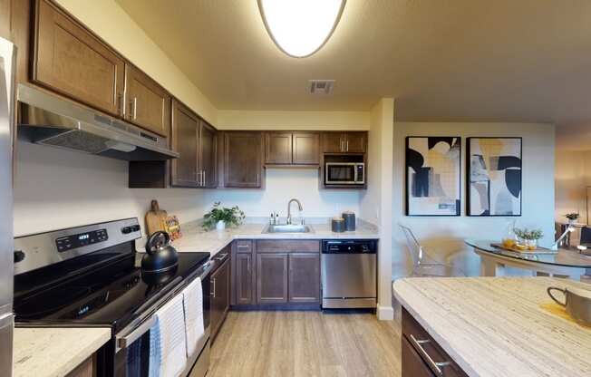 a kitchen with dark wood cabinets and stainless steel appliances