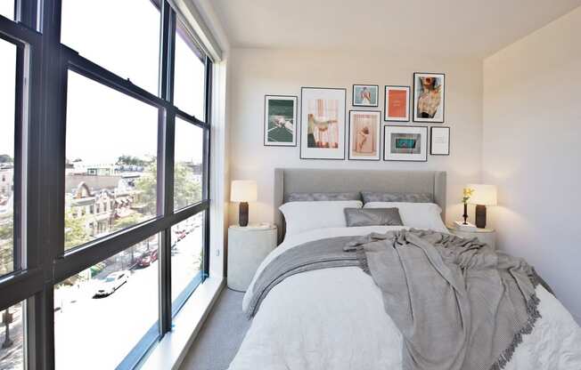 Comfortable Bedroom With Large Window at Fahrenheit Apartments, Washington, DC
