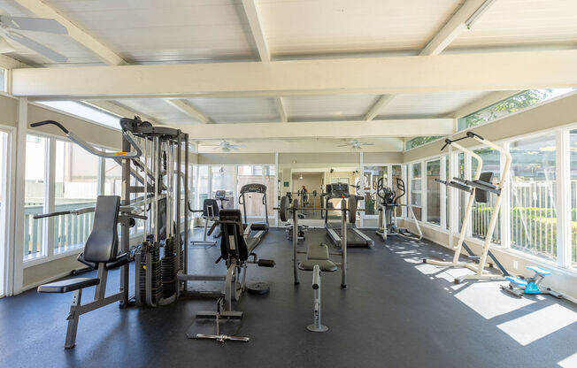 the gym is equipped with weights and cardio equipment at the resort