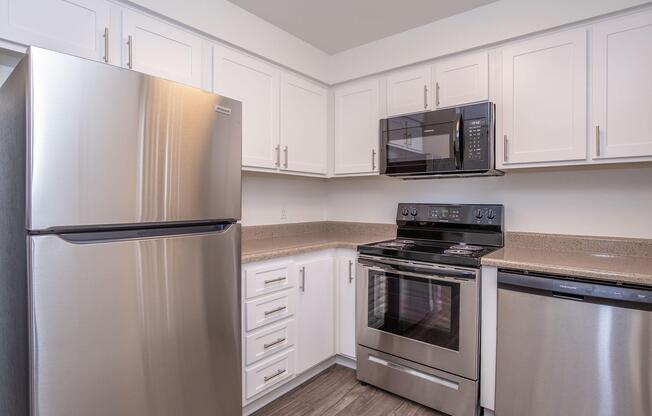 a stainless steel refrigerator in a kitchen