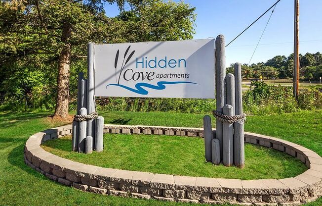 welcome sign for Hidden Cove Apartments