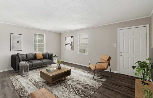 renovated apartment homes  Living Room with wood flooring at Midtown Oaks Townhomes in Mobile, AL