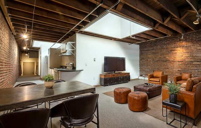 a living room with a television and a table and chairs