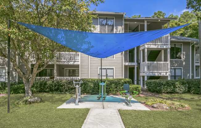 the preserve at ballantyne commons courtyard with a swimming pool and a blue canopy