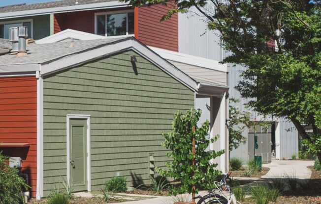 a group of bikes parked in front of a house