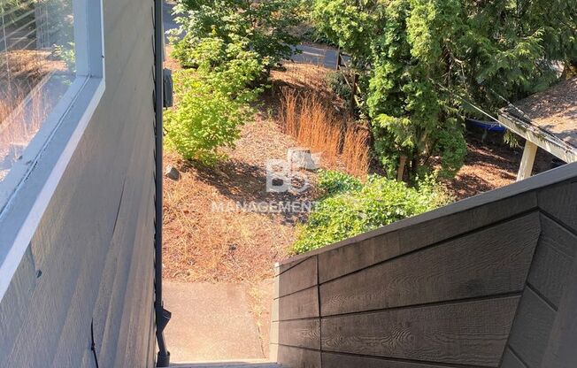 Spacious Multnomah Village Duplex sits amongst a treetop setting. Fenced Backyard. Landscaping Included!