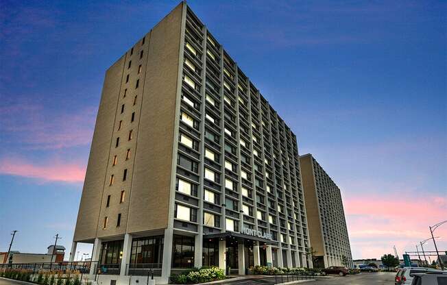 a tall building with a blue sky in the background