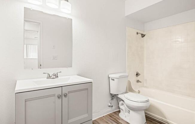 a bathroom with a toilet sink and bathtub