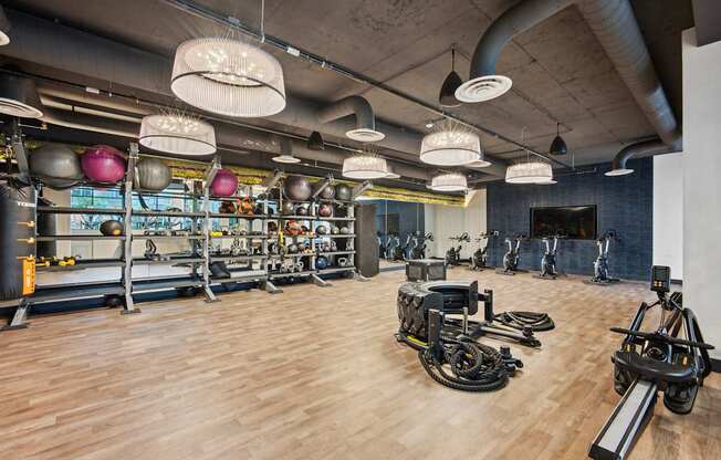 A gym with a variety of exercise equipment.