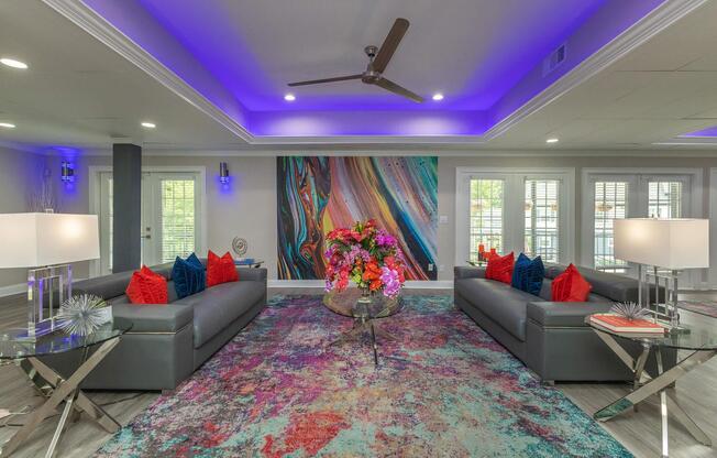 a living room filled with furniture and a flat screen tv