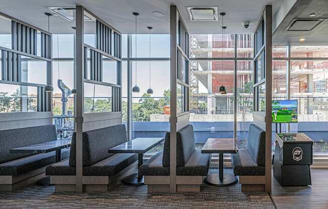 3thirty3 new rochelle ny apartment high rise photo of co-working area with multiple booths and tables for working and conferences