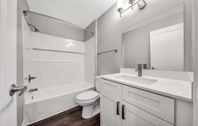 a bathroom with a sink toilet and a shower