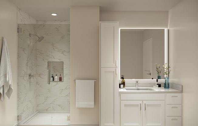 Serene bathrooms featuring quartz countertops and frameless glass showers.