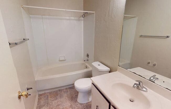 a bathroom with a sink toilet and a bath tub