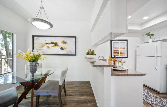 a kitchen and dining area in a 555 waverly unit