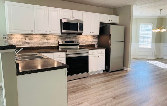 Prime location! 4 bed, 2.5 bath, LVP flooring, stainless appliances, ceiling fans, arched door ways, vaulted ceilings, must see!