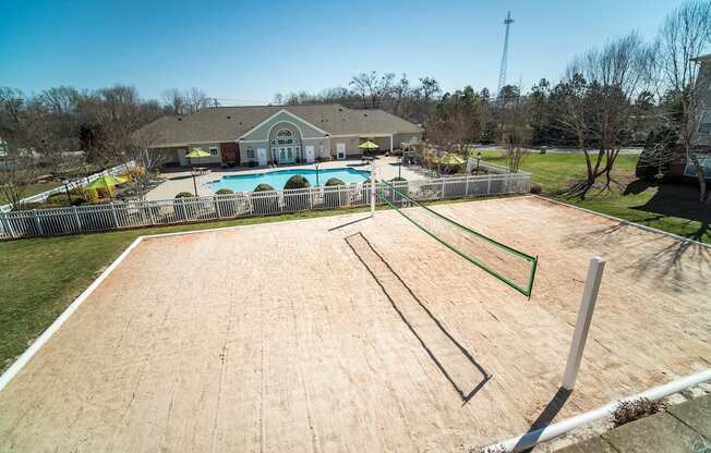 A swimming pool with a building in the background.