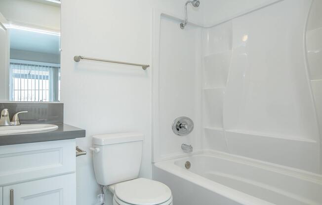 a room with a sink and a shower