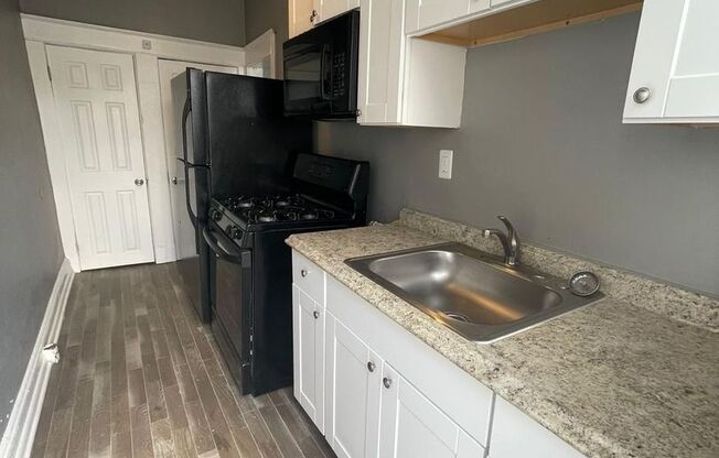 2 Bedroom + Den Home with Porch, Fenced Yard, and Water Included on Barclay Street