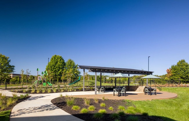 A playground with a slide and a canopy.