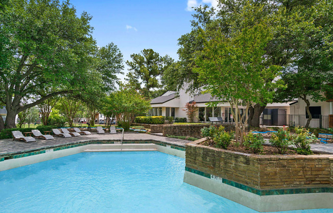 the swimming pool at the estates apartments