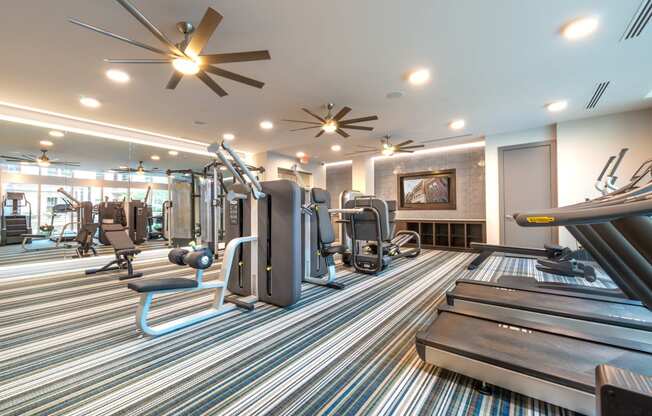 Fitness center with weights and treadmills