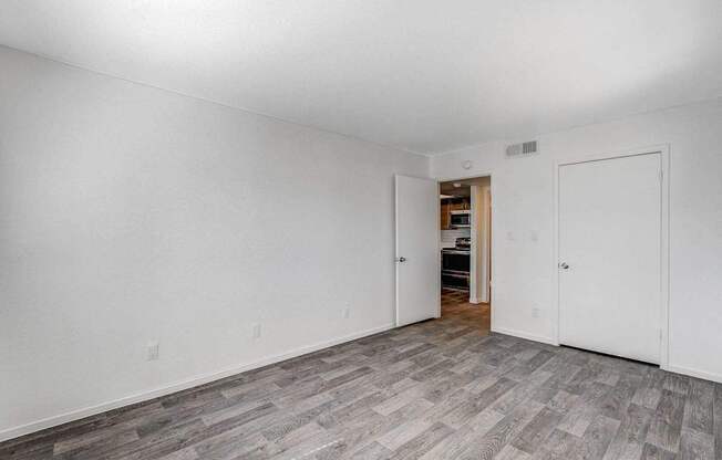 A room with a grey floor and white walls.