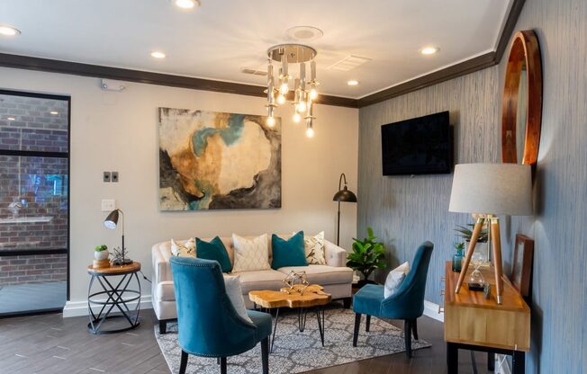 a living room with a couch and a chandelier